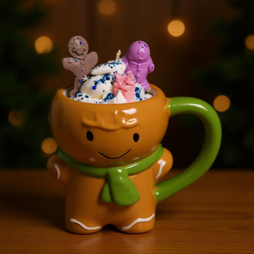 Gingerbread-themed mug with candy characters on a wooden surface