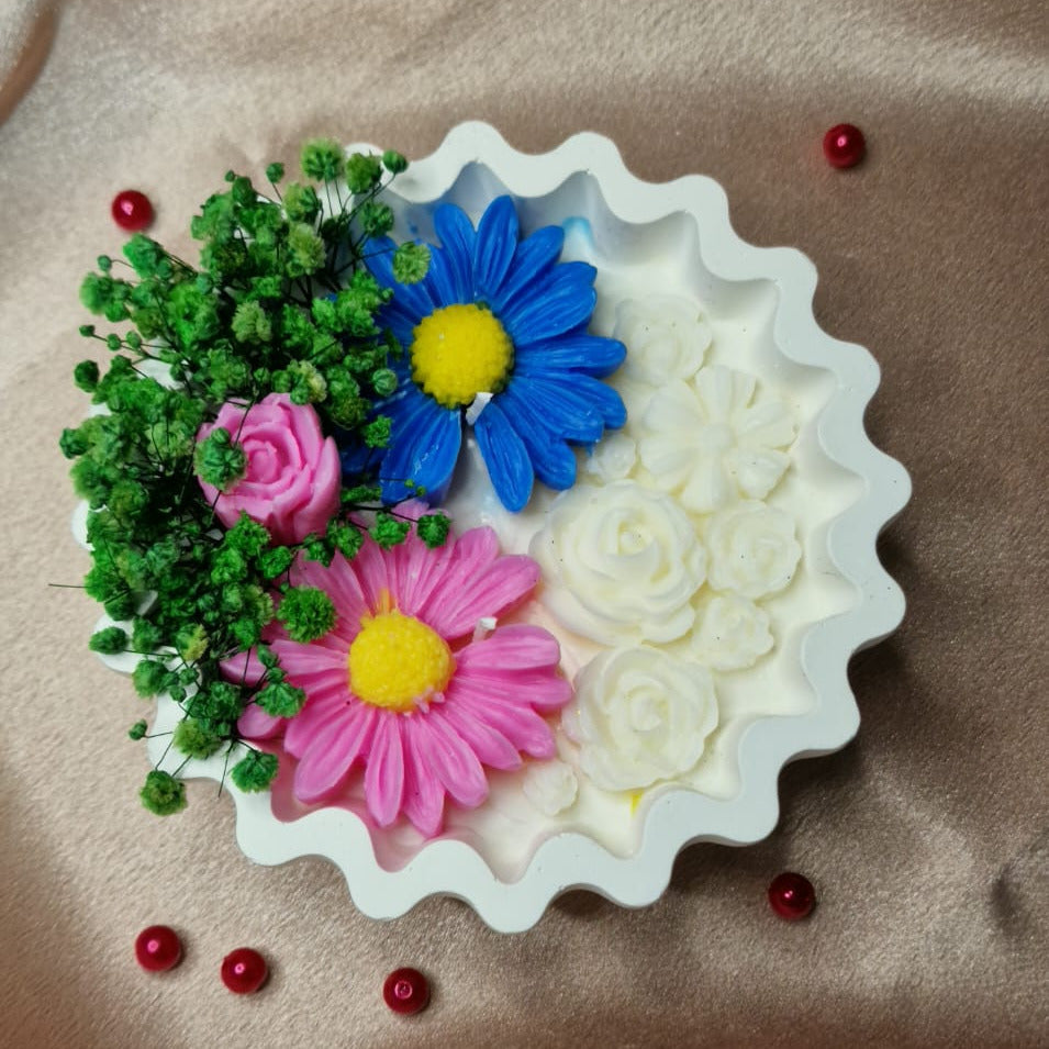 Decorative soap with floral designs on a brown fabric background